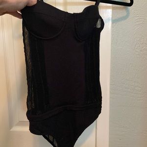 Sexy black bodysuit underwire with sheer side panels by Kiki de Montparnasse.